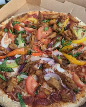 Pizza Hand Tossed Vegan Chicken Harissa at Domino's Pizza in Bruges