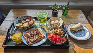 chicken curry wrap; chocolate croissants; a pastry with warm spiced apples; toast with butter, homemade jam, hummus, and vegan Nutella (chocolate hazelnut spread); yogurt with frui at Vegan B&B Valkenbos in The Hague