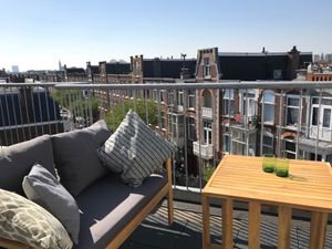 Rooftop terrace adjacent to the Sakura room, also accessible for guests of the Flora room. Both rooms have their own private set on the terrace. On warm spring and summer days breakfast is served on the terrace.  at Vegan B&B Valkenbos in The Hague