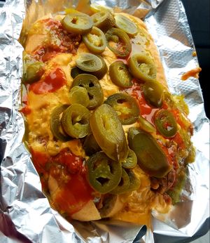 Double Dog Dare. Two vegan chili cheese dogs. I added Valentina, Sarah Jane's Jalepeño Mustard Sauce, and jalepeños of course! at Wheat Street Dogs - Food Cart in Wichita