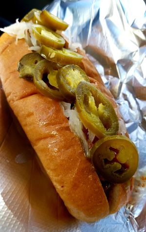 I added custom toppings. Sauerkraut, jalepeños, Valentina, Sarah Jane's Jalepeño Mustard Sauce, and a little ketchup. Delicious!!! at Wheat Street Dogs - Food Cart in Wichita