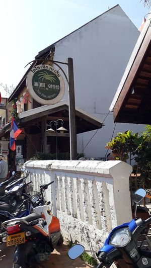Street sign at Coconut Garden in Luang Prabang
