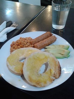 Vegan sausage and avocado with beans and a buttered bagel at Thought Foundation in Birtley