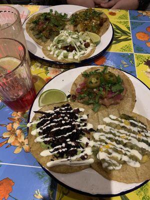 All the veggie tacos: hibiscus with guacamole - chile poblano - frijoles - special of the week with cauliflower - nopales - pastor with mushrooms.   at Taco Santo in Ghent