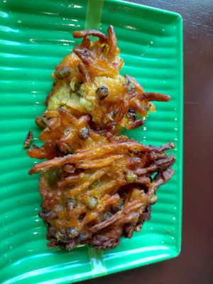 Corn fritters (half eaten) at Hanh Phuc - Vegetarian Restaurant in Surry Hills