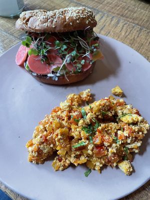 Breakfast bagel and scrambled tofu con hogao   at KAIME in Medellin