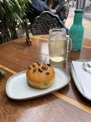 Pistachio doughnut and hatsu tea  at KAIME in Medellin