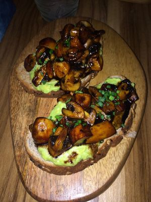 Toasted bread with avocado and marinated mushrooms at KAIME in Medellin