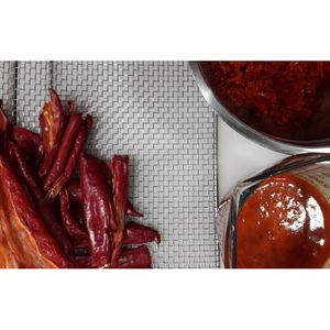 Processing our red peppers! at NektaR in Crete