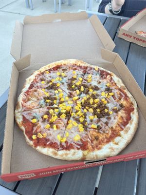 my pizza with vegan cheese, plant-based sausage and corn!   at Mod Pizza in California