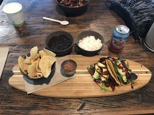 Tacos served on a surfboard!  at The Secret Spot in Huntington Beach