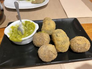 Croquettes with spinach and with mushrooms, together with a green curry sauce. (Sorry, we started eating before taking this picture.)  at Sabores de Sandra in Mallorca