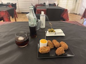 Croquettes with the spicy aioli. Marinated olives come free.  at Sabores de Sandra in Mallorca