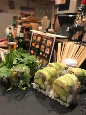 Avocado sushi with coriander. at Sushi Roll Double Quotation IKI in Osaka