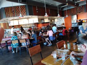 You follow as your personal pizza is being made and pick your own seating at Blaze Pizza in Tracy