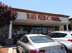 The front. It's located in a shopping center. at Blaze Pizza in Tracy
