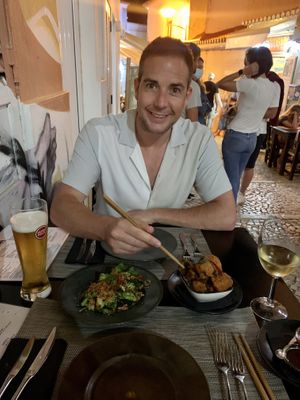 Lovely setting down a little alley way with blankets on chairs  at Gorilla in Lagos