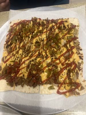 Cheesesteak flat bread. Beware: it has jalapeños on it   at Dina's Vegan Deli & Desserts in West Palm Beach