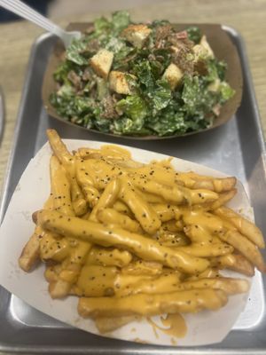 Best cheese fries ever and steak Cesar salad 🤤  at Dina's Vegan Deli & Desserts in West Palm Beach