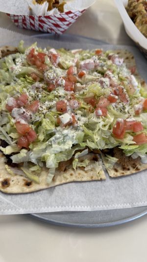 Gyro pizzaa  at Dina's Vegan Deli & Desserts in West Palm Beach