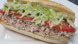 JACKFRUIT TUNA HOAGIE - organic jackfruit seasoned right with fresh onions, lettuce, tomatoes, sweet peppers served on a hoagie roll.  Mouth watering... at Dina's Vegan Deli & Desserts in West Palm Beach