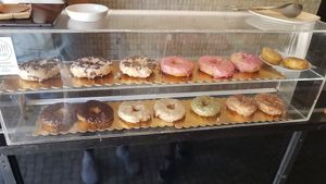 Vegan donut display at DUH Vegan in Porto