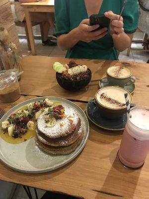 Tropical pancakes, açaí bowl, cappuccino and the Barbie latte  at EatMyTrip  in Barcelona