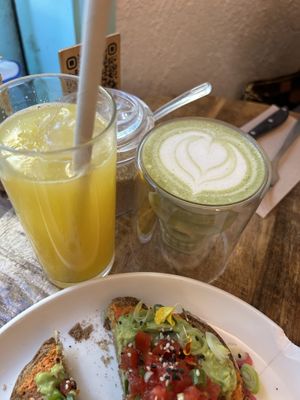 orange juice and matcha latte with oat milk  at EatMyTrip  in Barcelona
