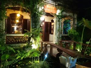 Inside the restaurant:  customers are seated in a spacious open-air garden with a pond of white lotus & small fishes. The white lotuses here look exceptionally elegant with many sm at Minh Hien 3 in Hoi An