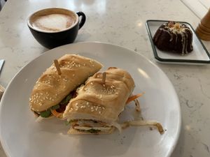 Banh mi, pumpkin spice latte (oat milk) and Bundt cake  at Moss Café in Bronx