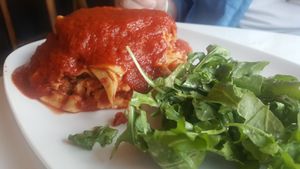 Lasagna with rosemary sage seitan & arugala salad at Celesta in Milwaukee