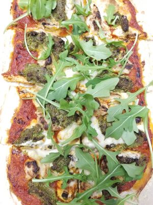 pumpkin seed pesto, almond ricotta & cashew mozzarella pie topped with fresh arugula - housemade pizza specials every Thursday! at Celesta in Milwaukee