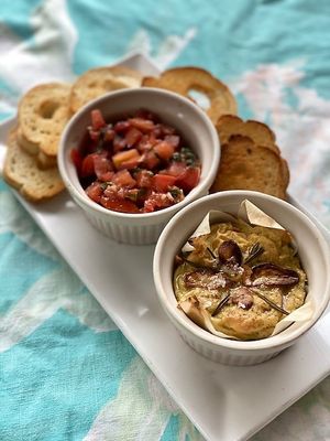 Vegan Brie made in house with Bruschetta. GF option avaiable.  at Celesta in Milwaukee