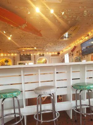 Tips in the ceiling! at Surfin' Spoon in Nags Head