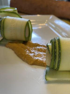 Rotolini di zucchine marinate ripiene di crema di mandorle su salsa di panzanella  at La Pepiniere in Florence