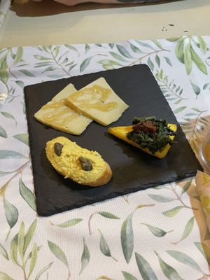Variety of vegan starters : vegan cheese with rice Sirup, polenta with spinach and vegan tuna spread. So good!!  at La Pepiniere in Florence