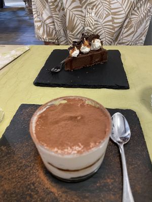 Tiramisu (good) and the chocolate/salted caramel cake (very good)   at La Pepiniere in Florence