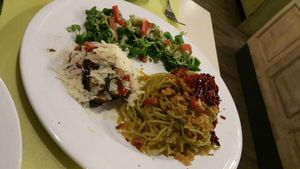Spaghetti with eggplants, tomatoes and greens at La Pepiniere in Florence