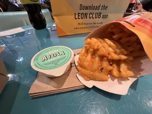 Waffle fries and aioli   at LHR - Leon - T2 in West London