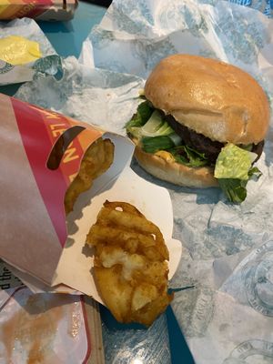 Veg burger and waffle fries    at LHR - Leon - T2 in West London