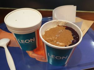 Cashew milk porridge with almond butter and fruit compote at LHR - Leon - T2 in West London