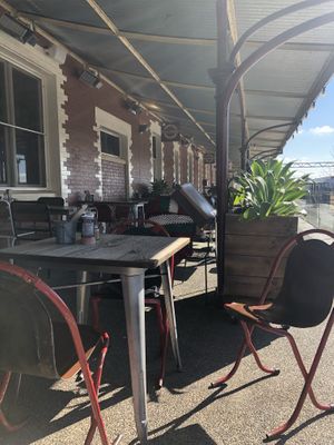 Outdoor seating on the train platform at BeanStation Cafe in Wodonga