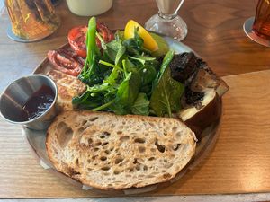 Sourdough toast with tomatoes, mushroom, arugula, fruit jam, and lemon  at Common Man Coffee Roasters in Central Singapore