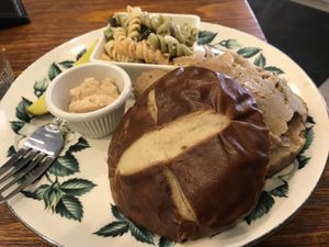 “Beef” (seitan) on pretzel bun with horseradish and pickle at 96 Lives Vegan Bakery and Cafe in Lancaster