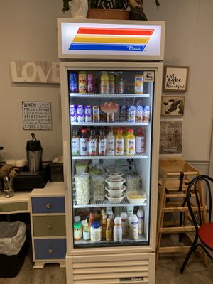 Fridge with takeout menu at 96 Lives Vegan Bakery and Cafe in Lancaster