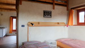 West room.
3 large independent rooms, each with an en-suite bathroom, kitchen area and terrace. at Casa Payer in Luserna San Giovanni