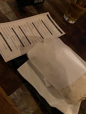 Gut gefüllter Burrito, bestellt wird per Kreuz  at Machete - Burrito Kartell in Innsbruck