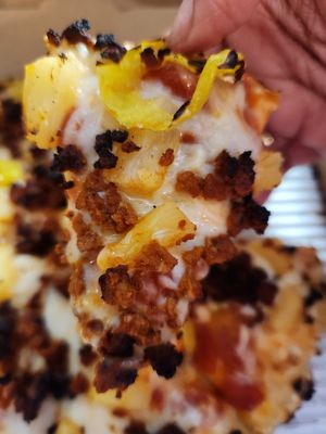 Build your own pizza with the 9" small thin style pan crust, banana peppers, pineapples, soyrizo, Daiya cheese, and marinara sauce at Pizza Cat in Toledo