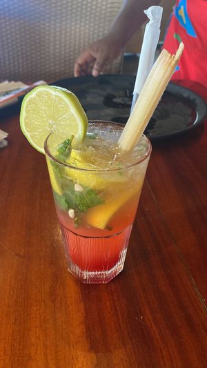 Red mojito drink with sugarcane  at Mundo's in Maputo