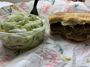 Veggie burger and cabbage salad 😋  at Woody's Oasis in East Lansing